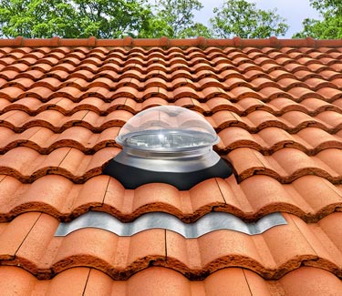 Mill finish Natural Light tubular skylight on clay S tile roof thumb