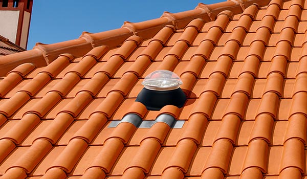 Natural Light tubular skylight on clay tile roof mobile